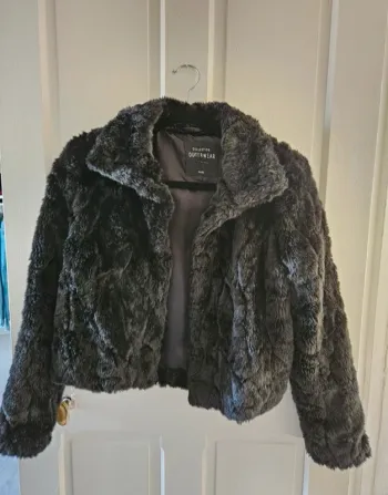 Manteau fausse fourrure T.S