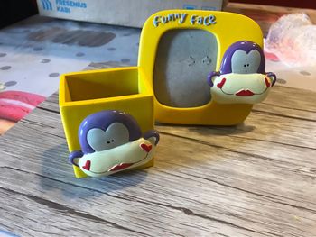 Cadre photo et petit pot singe