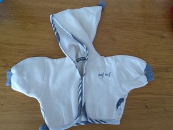 Gilet crème à capuche