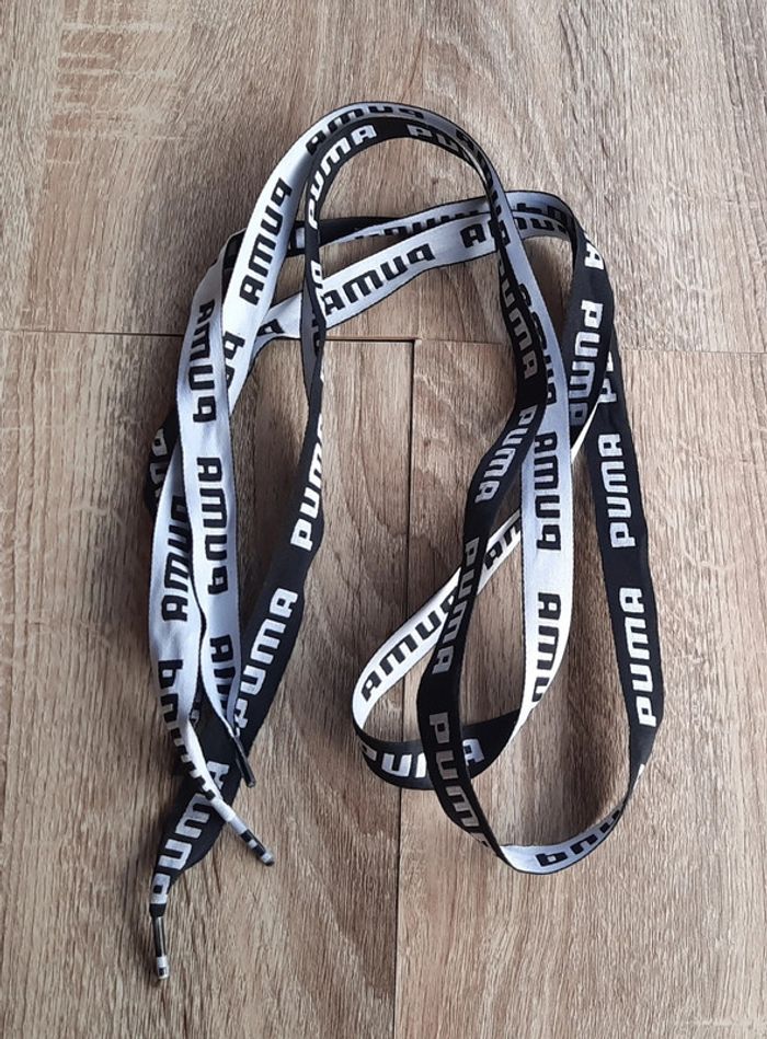 Lacets neufs Puma noirs et blancs - photo numéro 2