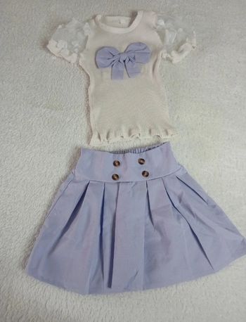 Joli ensemble jupe et maillot taille 5ans