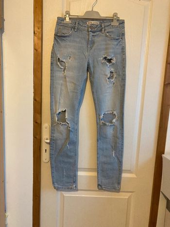 Jean skinny taille mi haute bleu clair à trous