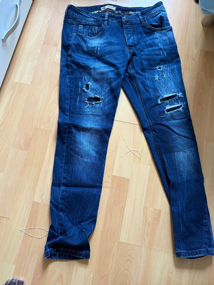 Jeans bleu déchiré pour homme