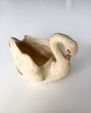Cygne cache pot ou vide poches