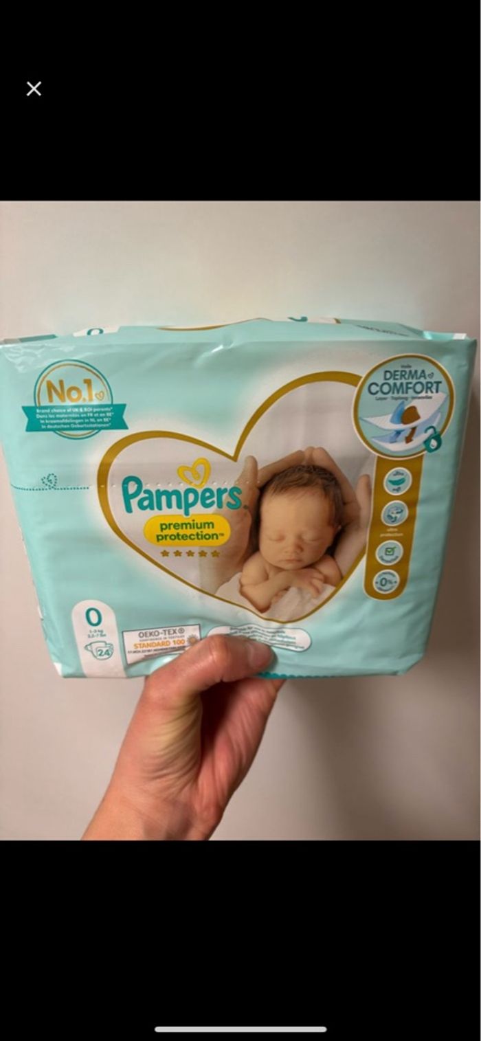 4 paquets de couches taille 0