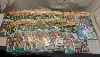 25 magazines pokemon + 50 boosters