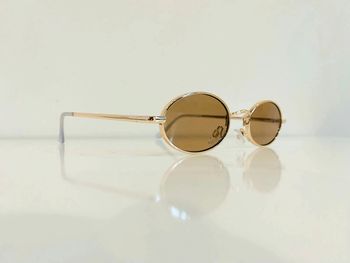 Lunette de soleil mixte ovale dorée uvprotection catégorie 2 taille small