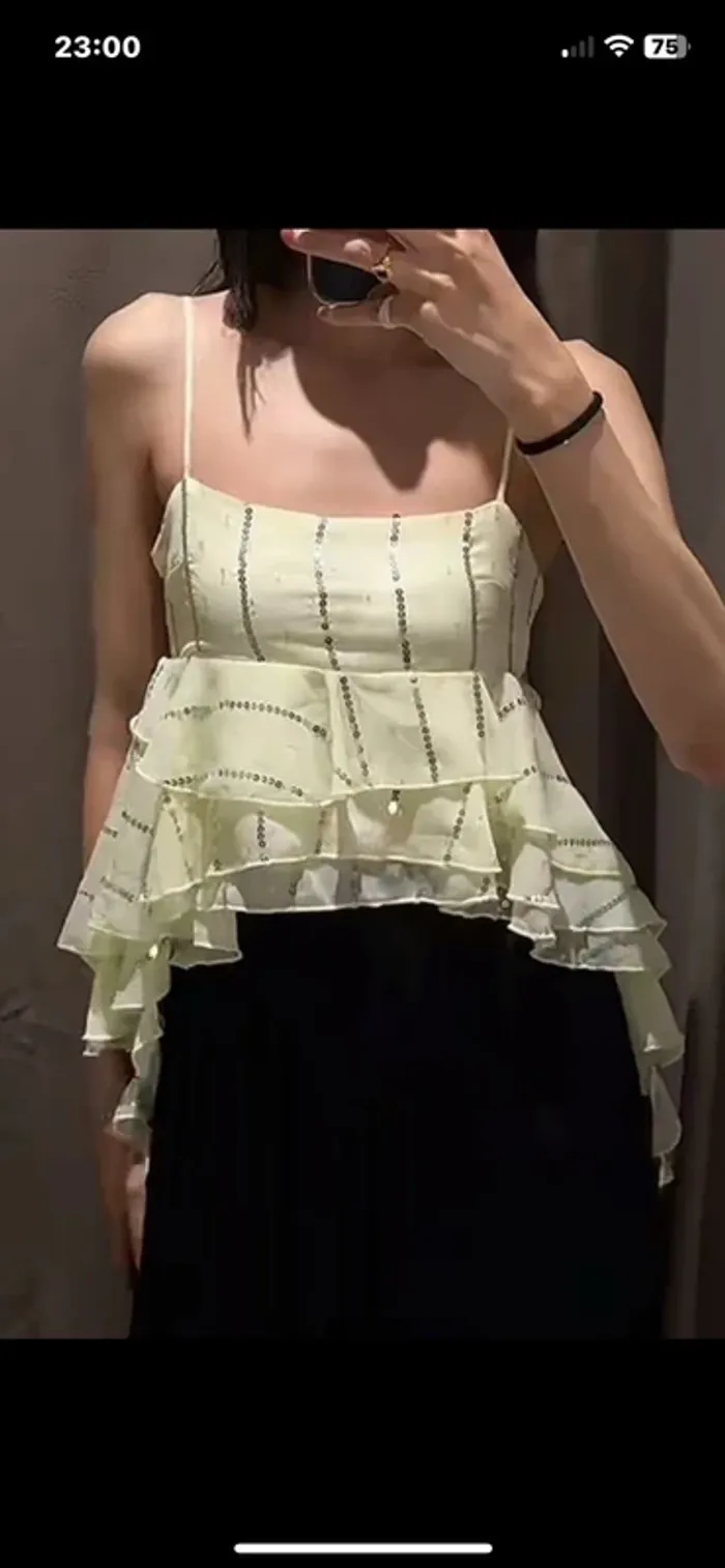 Très beau bustier asymétrique volant