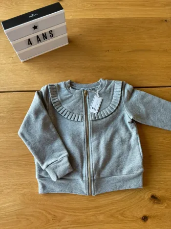 Veste/Cardigan zippée ML gris chiné, rebord plissé NEUVE - Taille 4 Ans