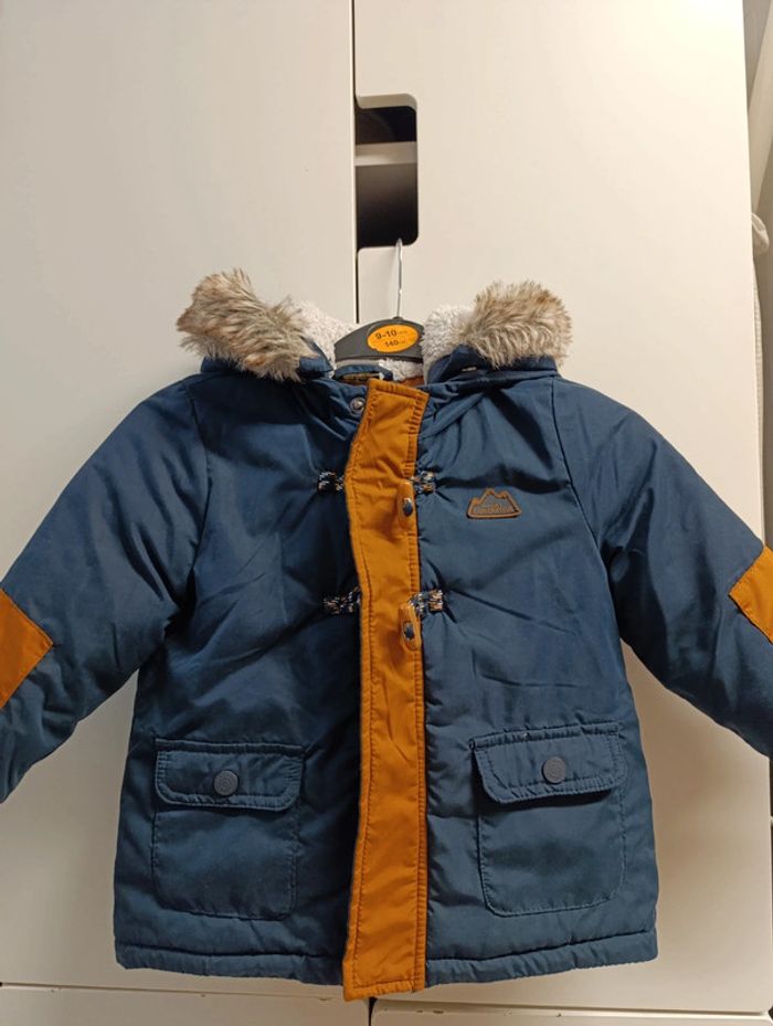 Doudoune garçon, Tape à l'oeil