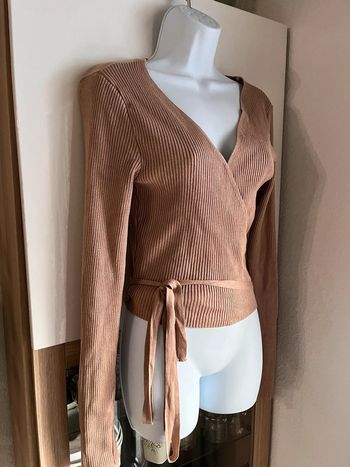 Pull cache cœur beige