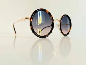 Lunette de soleil mixte marron léopard et dorée ronde UV protection verres dégradés