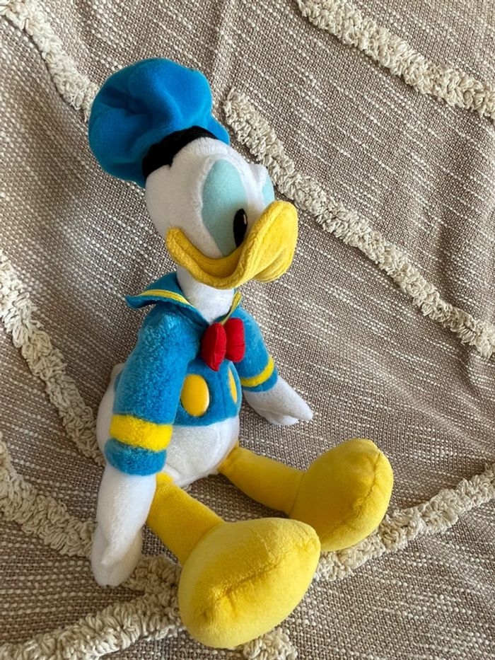 Peluche doudou 32cm Disney Donald bleu jaune et blanc très bon état