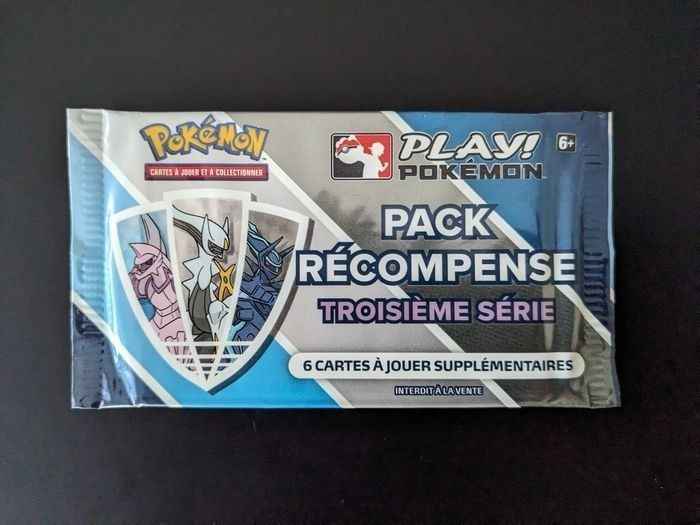 Pokémon booster pack récompense ligue 
Booster neuf scellé et officiel