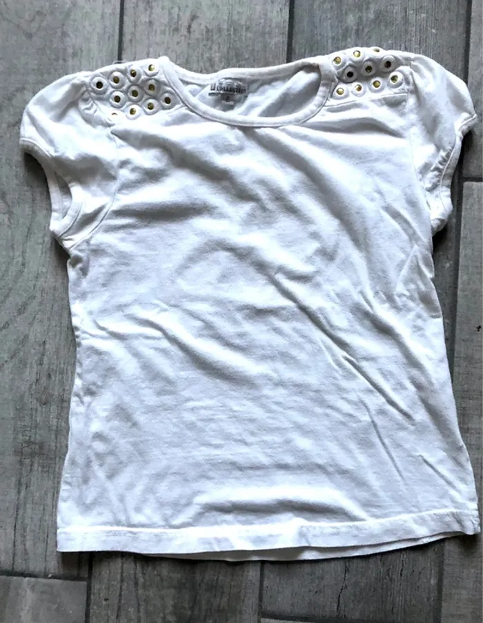 Haut blanc collection U TBE Taille 8 ans