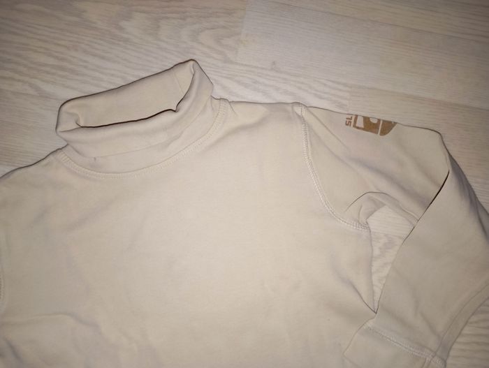 Sous-pull beige Kiabi
T. 8 ans - photo numéro 2