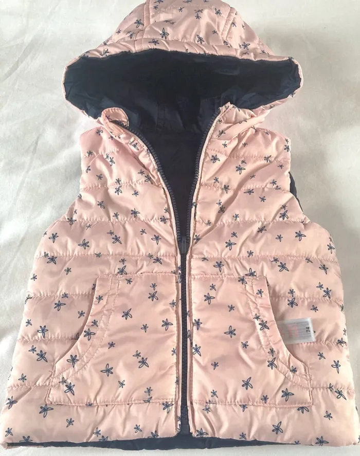 Doudoune à capuche réversible sans manches neuve