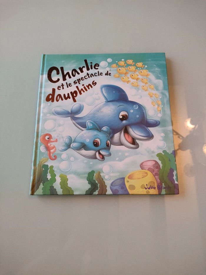 Livre charlie et le spectacle de dauphins