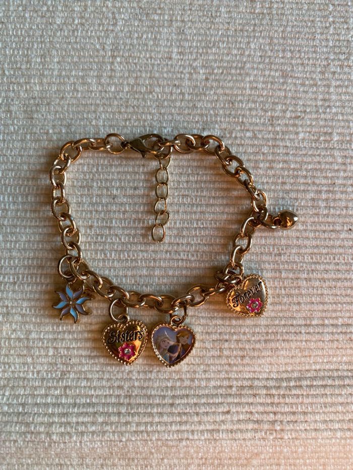 Bracelet en métal doré avec charms La Reine des Neiges Disney - photo numéro 2
