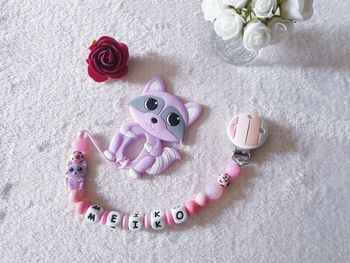 Attache tétine + jouet dentition