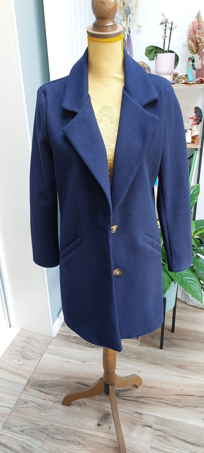 Manteau bleu de l'armoire de Suzette